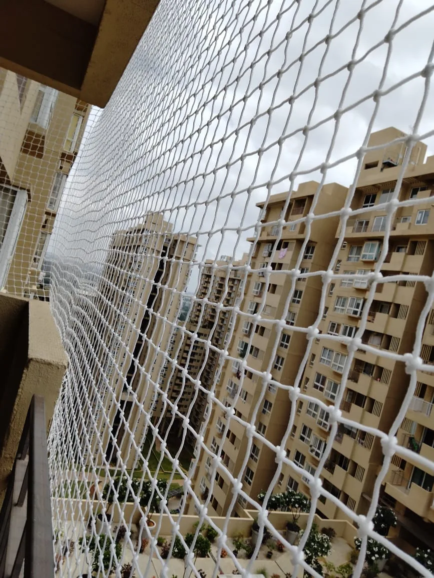 Knotted safety net on a high-rise balcony