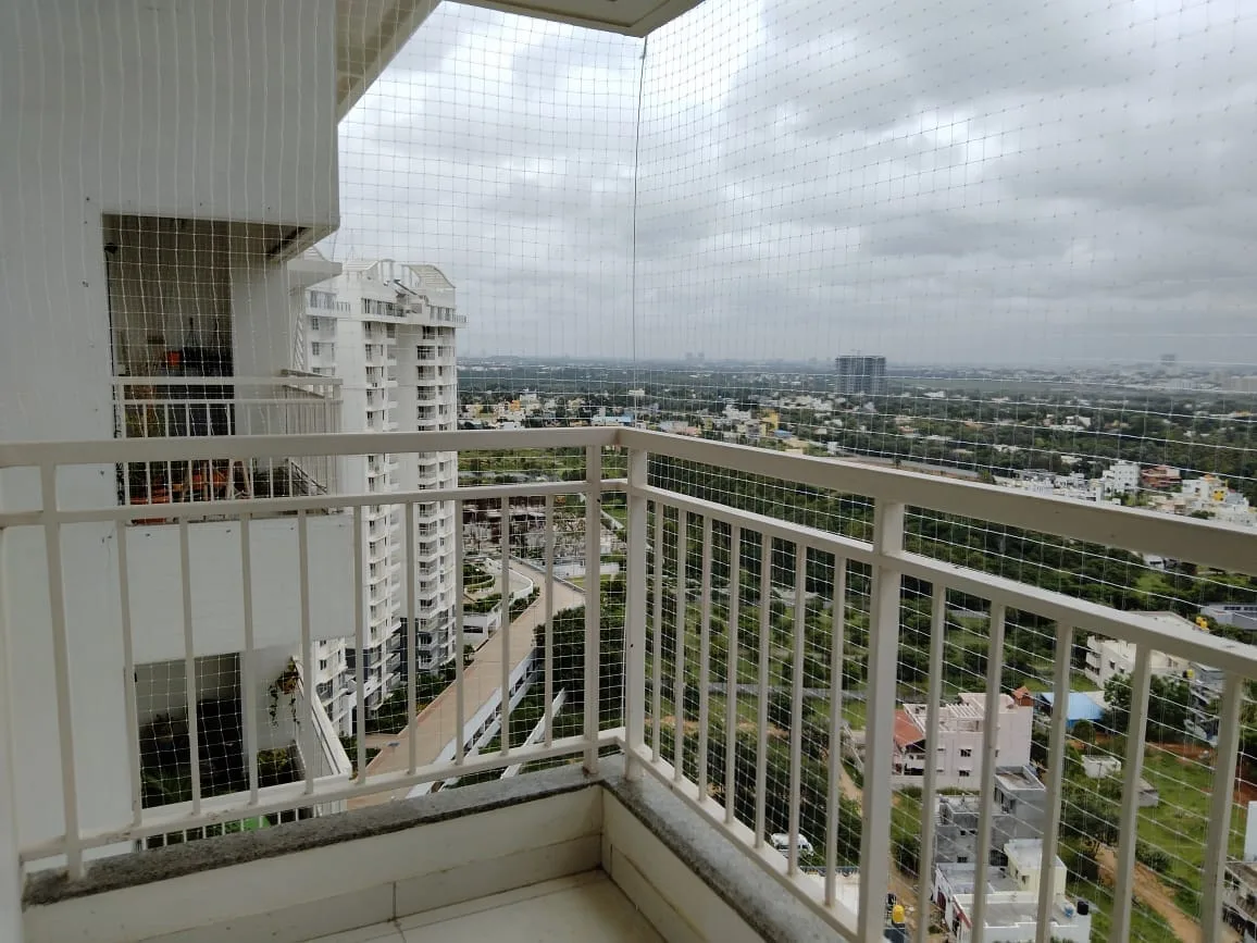 Safety net enclosing a high-rise apartment balcony