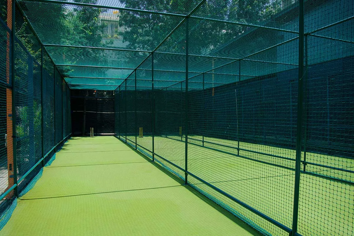 Fully netted sports practice enclosure with a steel frame
